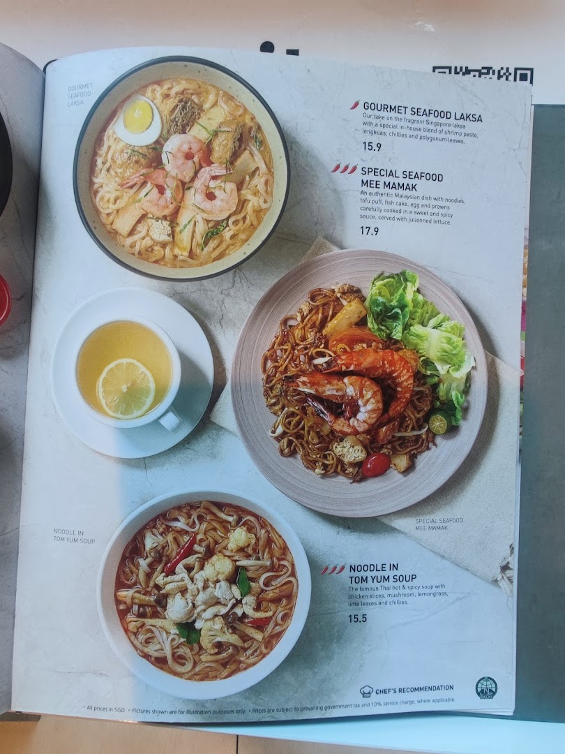 A menu page displaying delicious seafood laksa, mee mamak, and tom yum soup dishes.