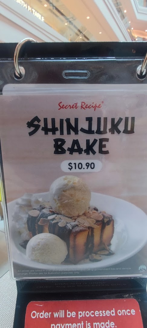 A menu display for Secret Recipe's Shinjuku Bake dessert, featuring a picture and price.