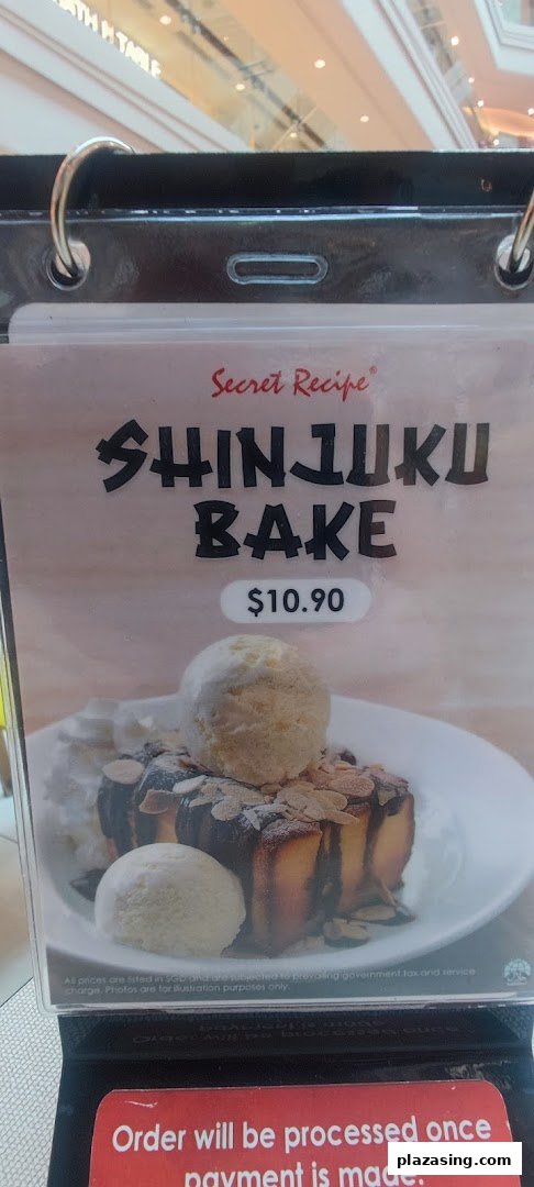 A menu display for Secret Recipe's Shinjuku Bake dessert, featuring a picture and price.