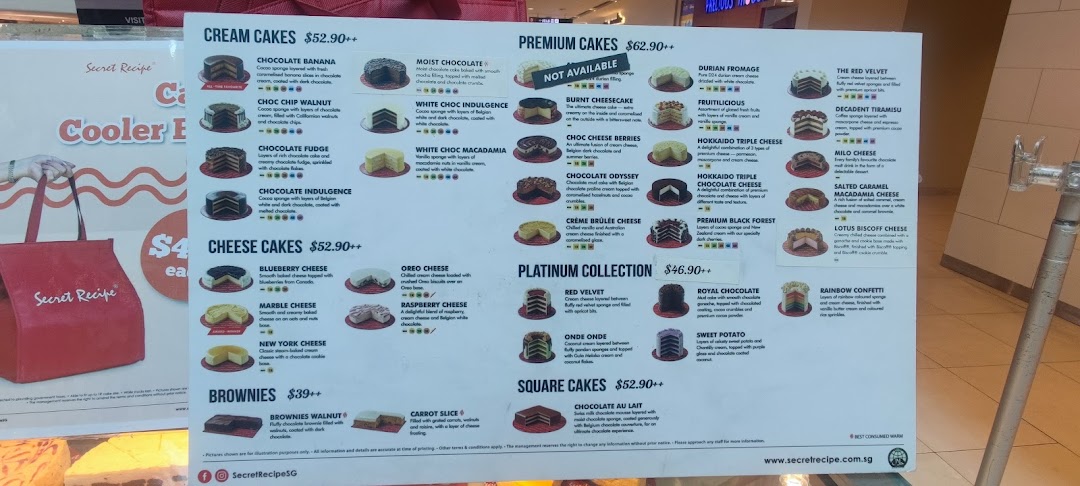 A detailed menu board showcasing various cakes, brownies, and their prices from Secret Recipe.