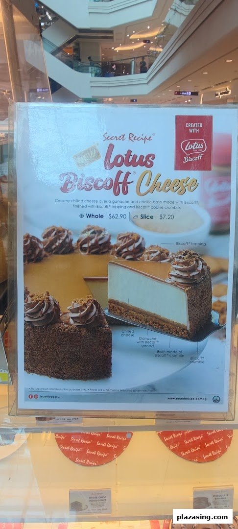A promotional poster for Secret Recipe's Lotus Biscoff Cheese cake, with other cake prices visible.