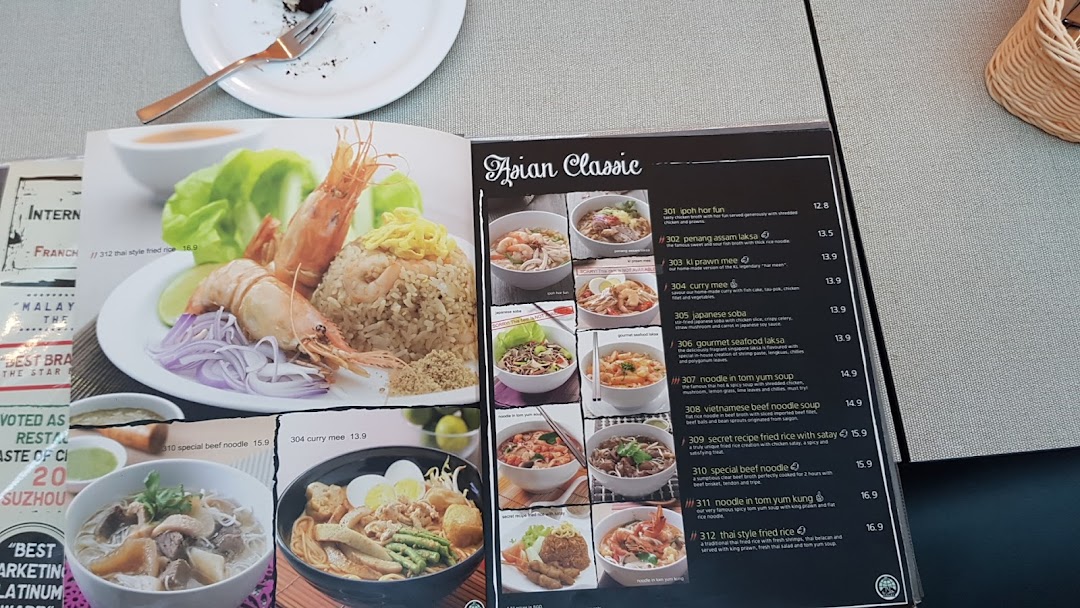 A close-up view of Secret Recipe's 'Asian Classic' menu page featuring various noodle and rice dishes.