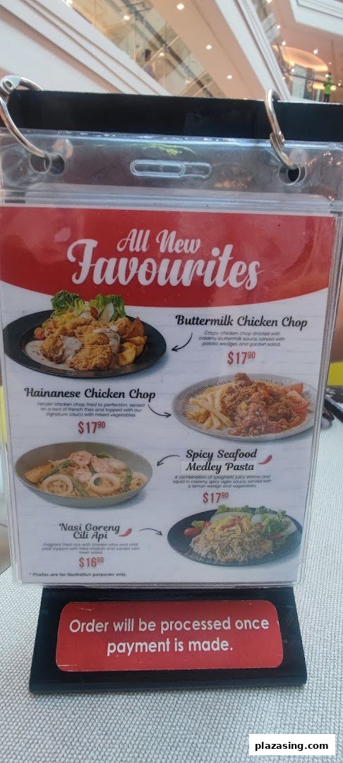 A close-up of Secret Recipe's 'All New Favourites' menu board displaying four main dishes with prices.