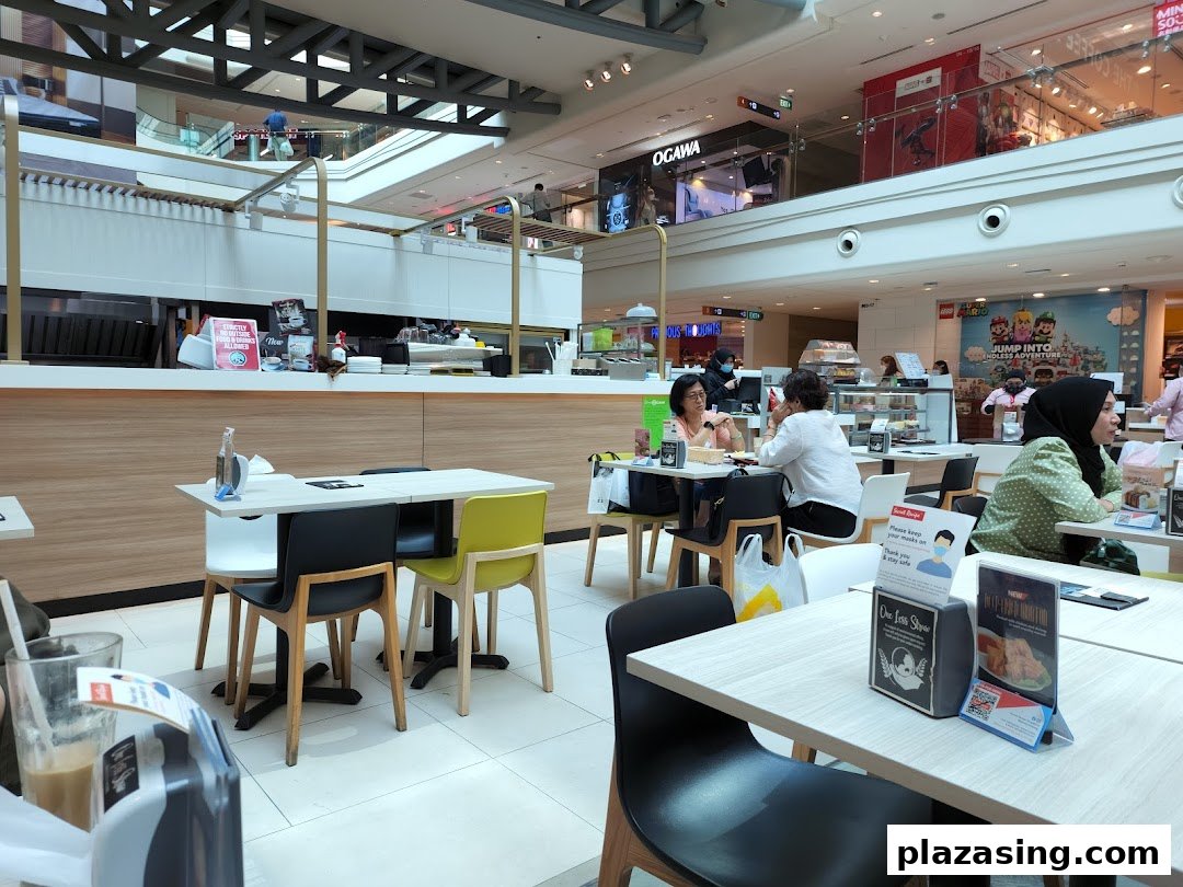 Interior view of Secret Recipe cafe with customers dining and a service counter.