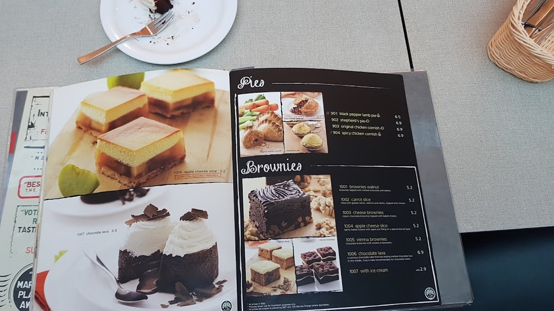 An open menu from Secret Recipe displaying various pies, brownies, and cakes with prices and descriptions.