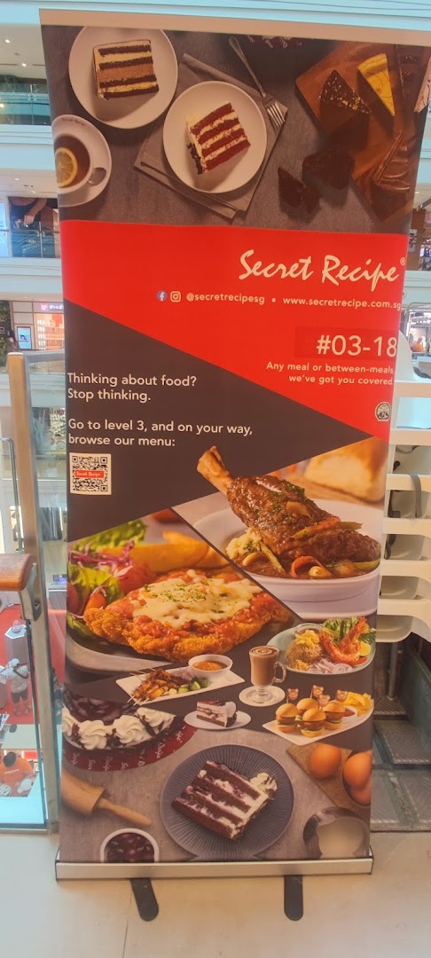 A Secret Recipe promotional banner showcasing various cakes, main courses, and snacks, inviting customers to their Level 3 outlet.