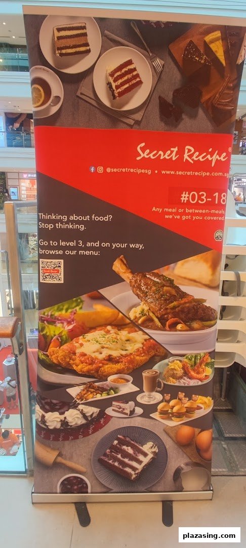 A Secret Recipe promotional banner showcasing various cakes, main courses, and snacks, inviting customers to their Level 3 outlet.