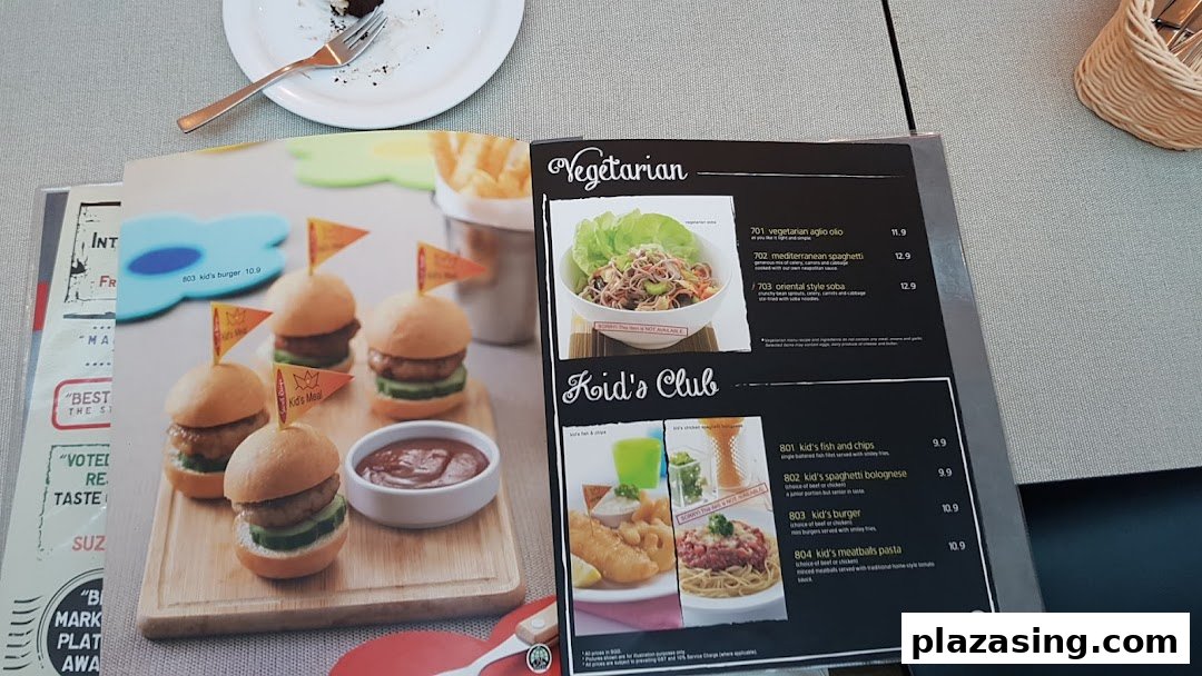 A close-up view of Secret Recipe's menu, featuring vegetarian and kids' meal options.
