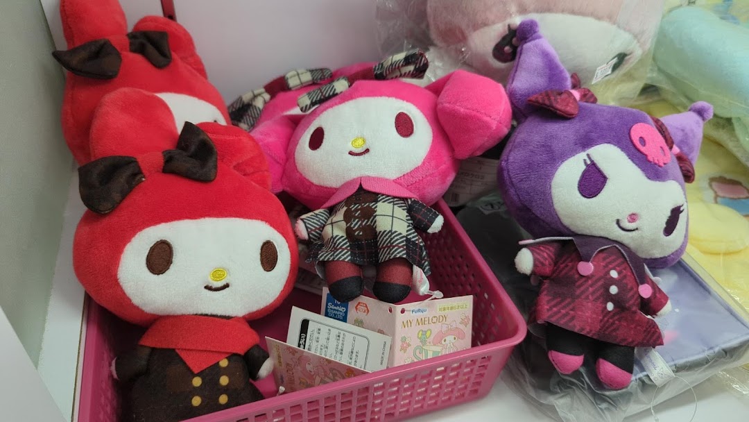 Close-up of adorable My Melody and Kuromi plush toys displayed in a retail shop.