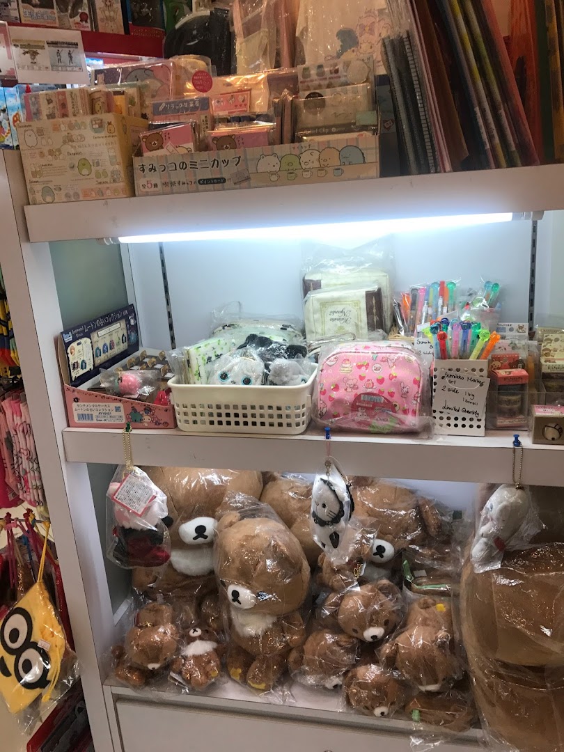 Shelves filled with adorable plush toys, stationery, and character merchandise, showcasing Seimon-Cho's charming product range.