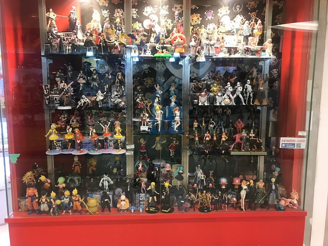 A vibrant display case showcasing a vast collection of anime, manga, and pop culture collectible figures.