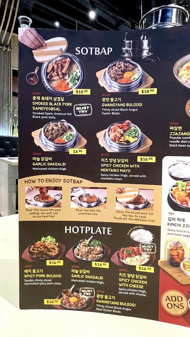 A vibrant menu board showcasing Korean SOTBAP and HOTPLATE dishes with prices and descriptions.