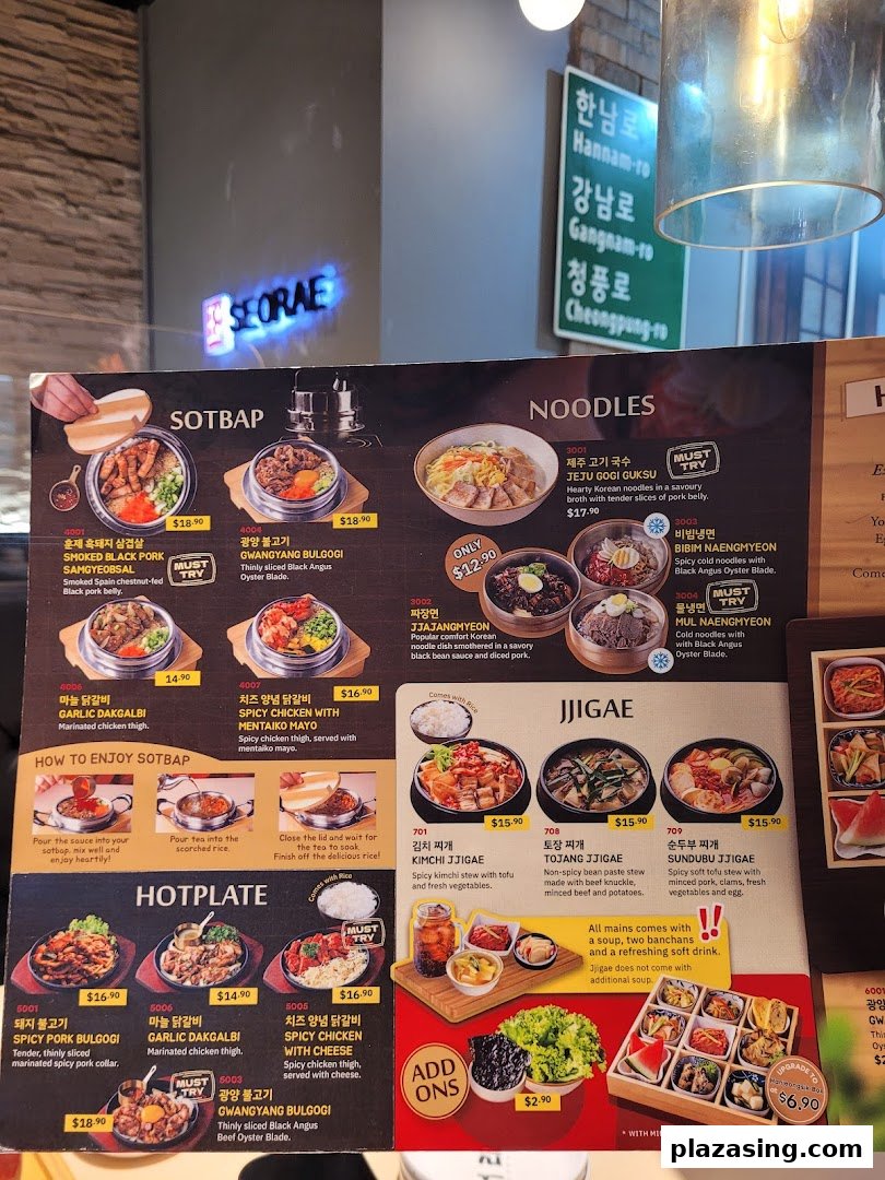 A detailed menu displaying various Korean dishes including sotbap, noodles, hotplates, and jjigae.