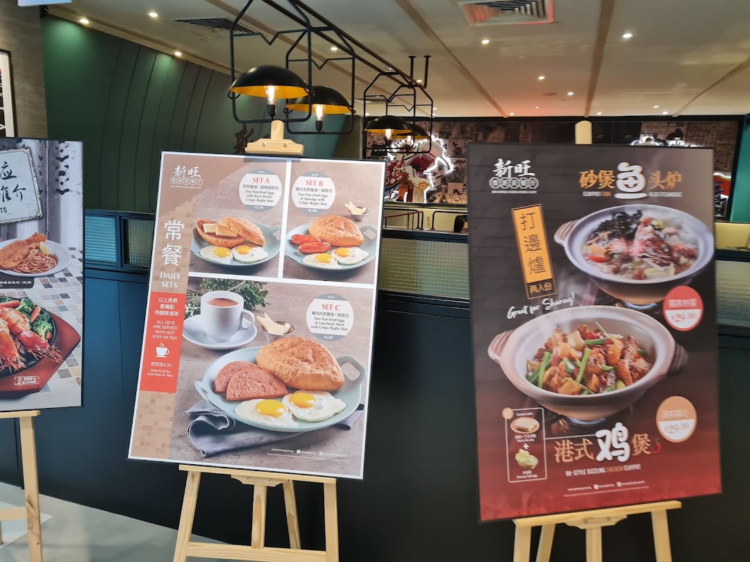 Large display boards showcasing various delicious food items and daily sets inside a restaurant.