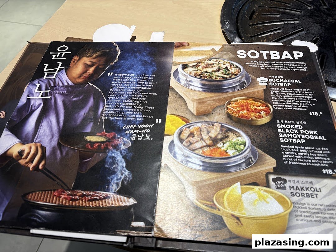An open menu from SEORAE JIB, showcasing Korean dishes like SOTBAP and a chef's philosophy.