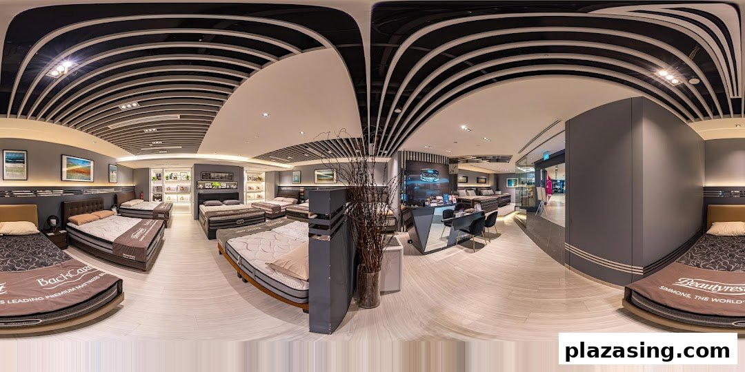 A wide-angle view of the Simmons Studio showroom, showcasing various premium mattresses and bed setups.