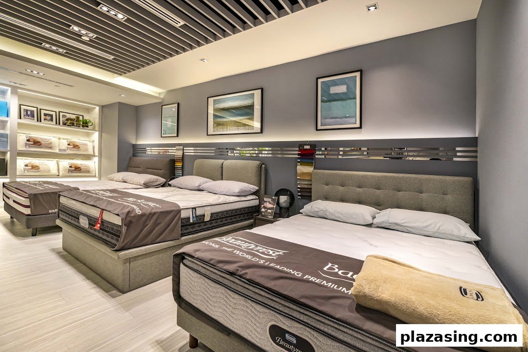 An interior view of Simmons Studio, showcasing multiple premium mattresses and bedding displays.