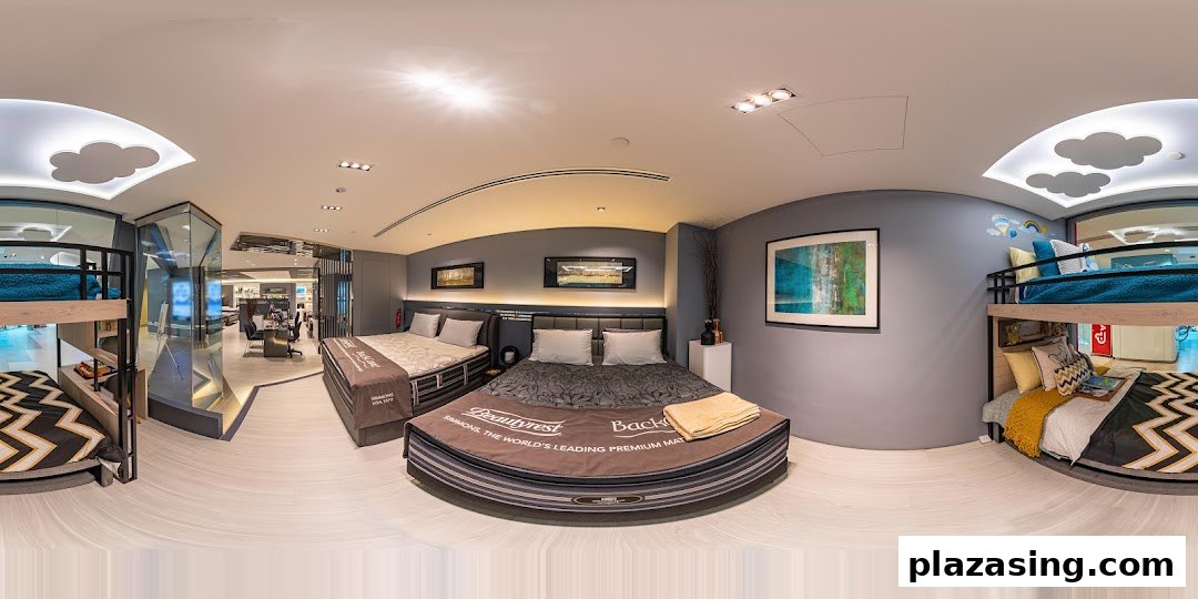 An interior view of Simmons Studio, showcasing various beds and mattresses in a modern showroom setting.
