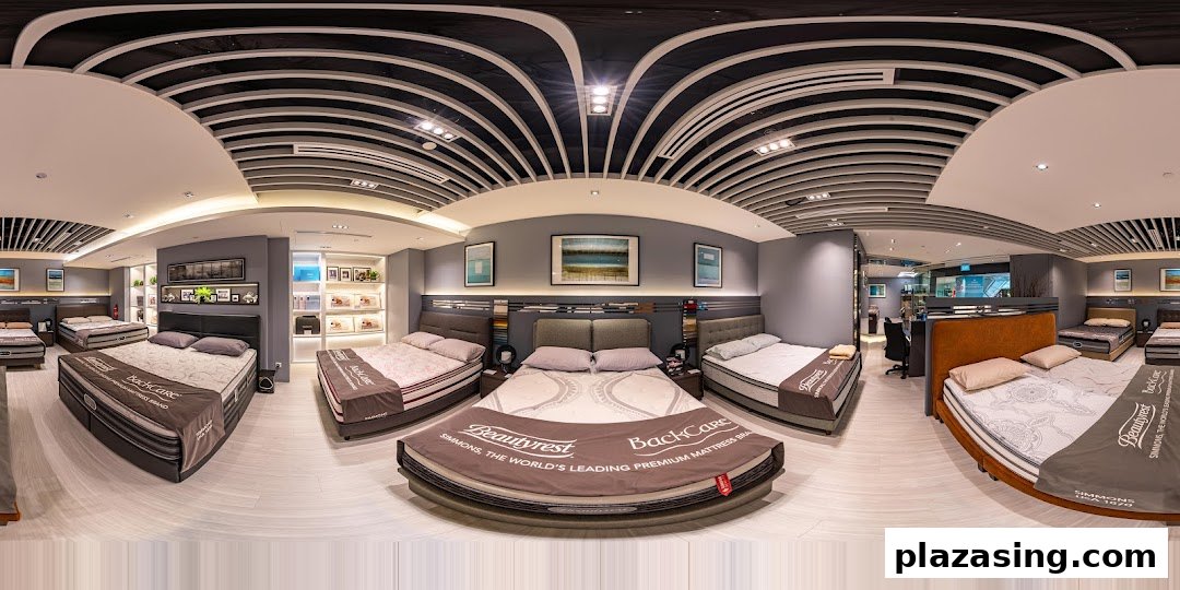 An interior view of Simmons Studio, showcasing various premium mattresses and bed frames in a modern showroom.