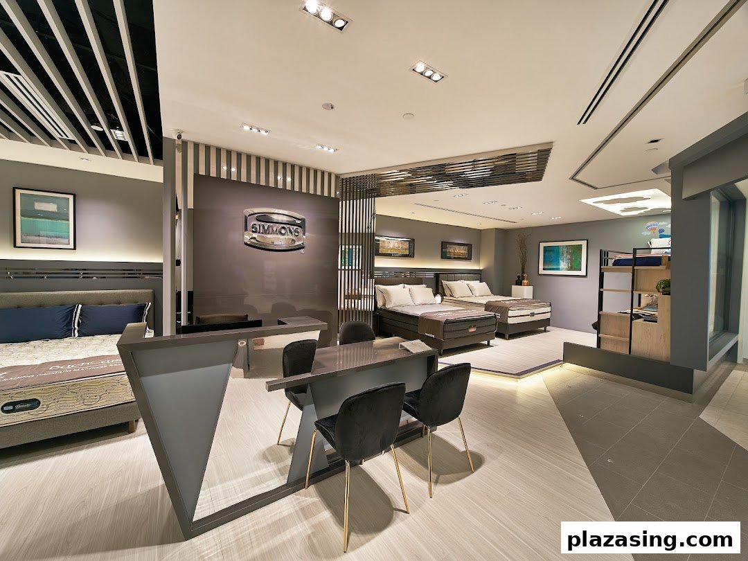 Interior view of Simmons Studio showcasing various premium mattresses and bedroom furniture displays.