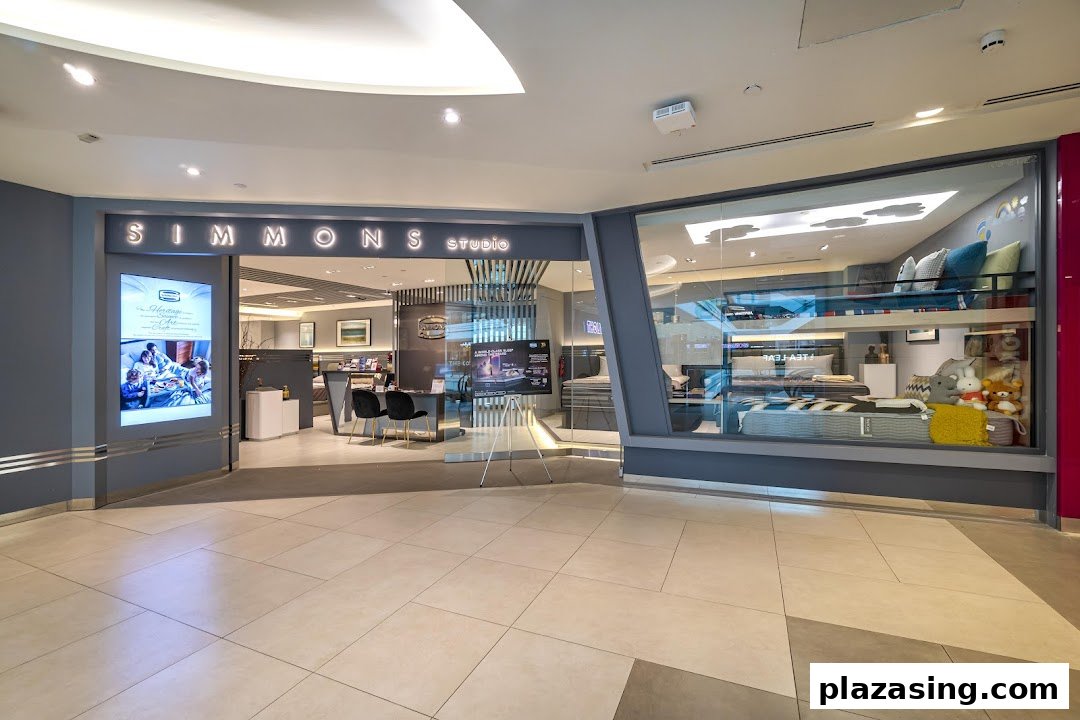 The exterior of Simmons Studio, a bedding and mattress store, featuring its entrance and display windows.