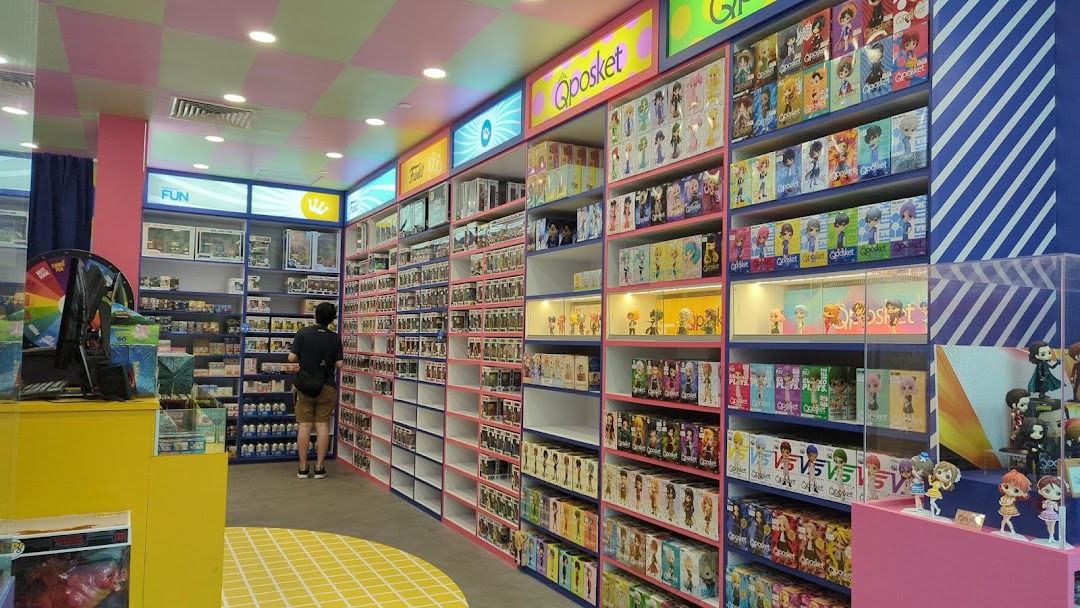 Vibrant interior of Simply Toys, showcasing shelves packed with collectible figures and a customer browsing.