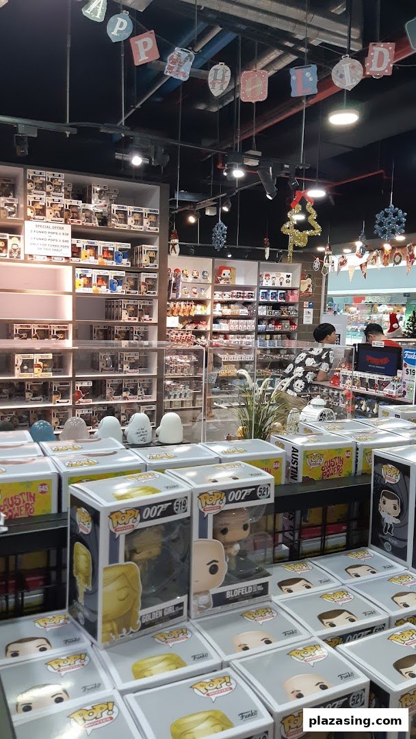 Interior view of Simply Toys, showcasing shelves filled with Funko Pop figures and other collectibles.