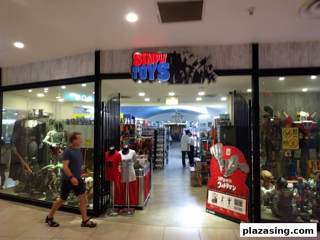 The entrance of Simply Toys, showcasing large action figures and pop culture collectibles in its display windows.