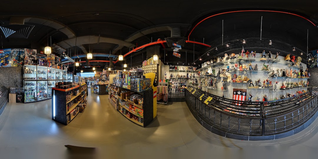 An expansive interior view of Simply Toys, showcasing a wide array of toys, action figures, and collectibles.