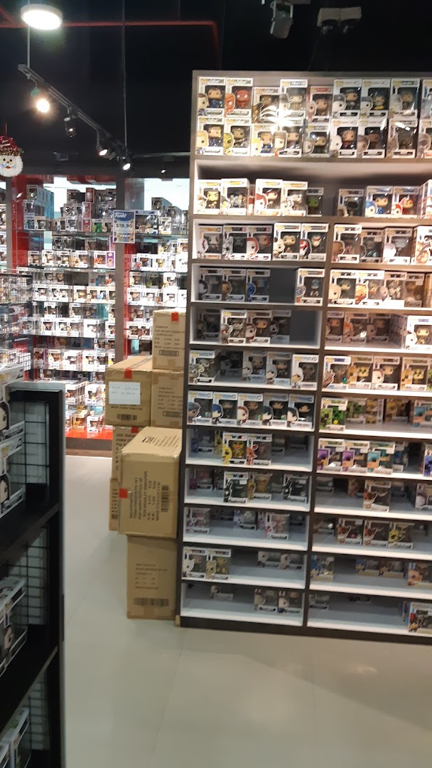 Interior view of Simply Toys, showcasing shelves filled with numerous Funko Pop figures and collectibles.