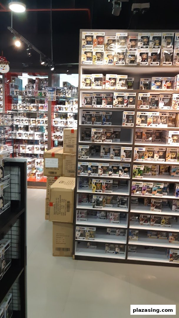 Interior view of Simply Toys, showcasing shelves filled with numerous Funko Pop figures and collectibles.