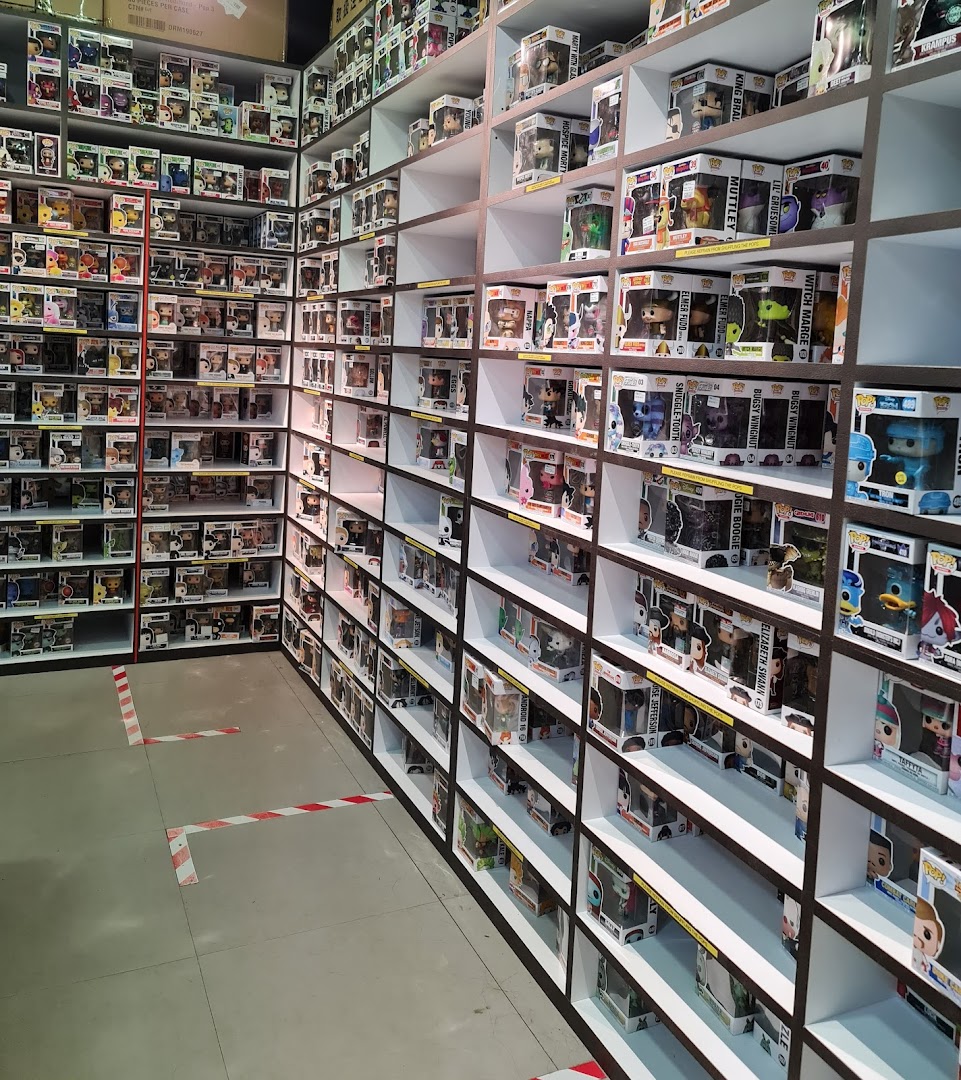 Interior view of Simply Toys, showcasing extensive shelves filled with collectible Funko Pop figures.