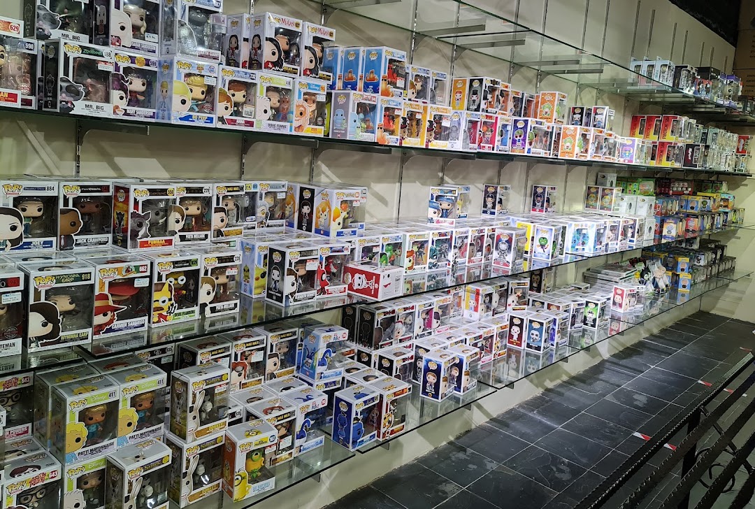 Shelves filled with numerous Funko Pop! collectible figures displayed in a retail toy store.
