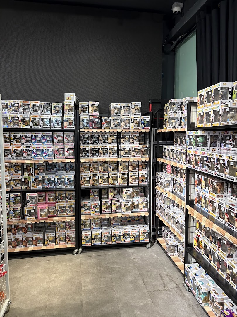 Shelves packed with numerous Funko Pop collectible figures inside Simply Toys.