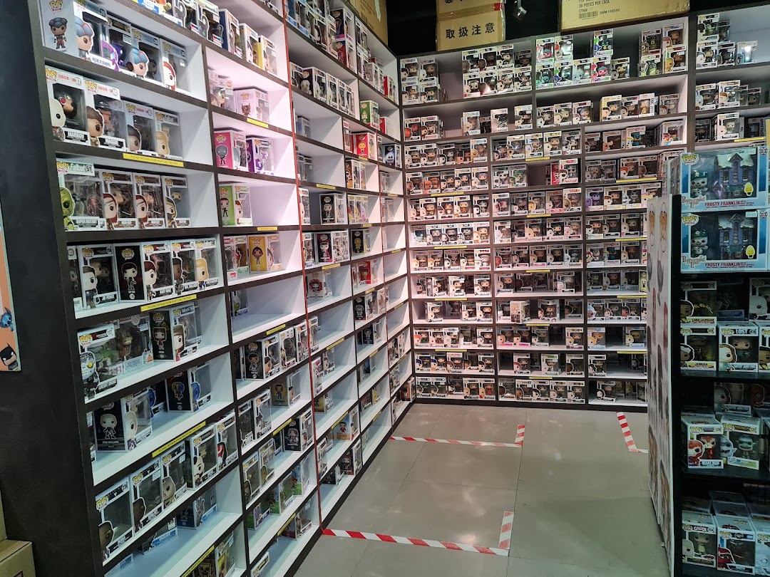 An aisle in Simply Toys showcasing extensive shelves filled with various collectible Funko Pop! figures.