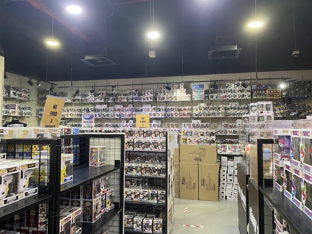 An interior view of Simply Toys, showcasing shelves filled with numerous Funko Pop collectible figures.