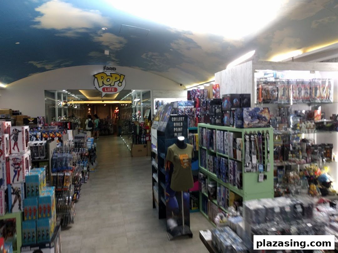 An interior view of Simply Toys, showcasing aisles filled with collectibles and a Funko Pop! Life entrance.