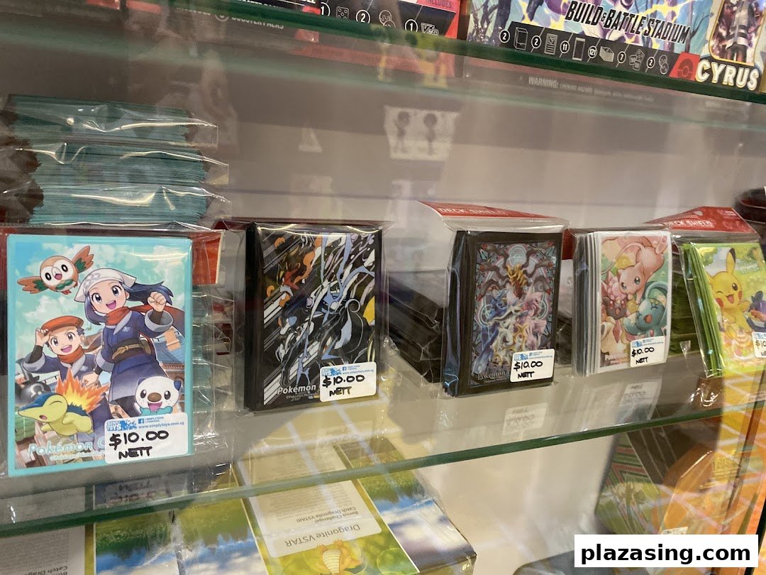 A retail shelf displaying various Pokémon-themed card sleeves and deck shields, each priced at $10.00.
