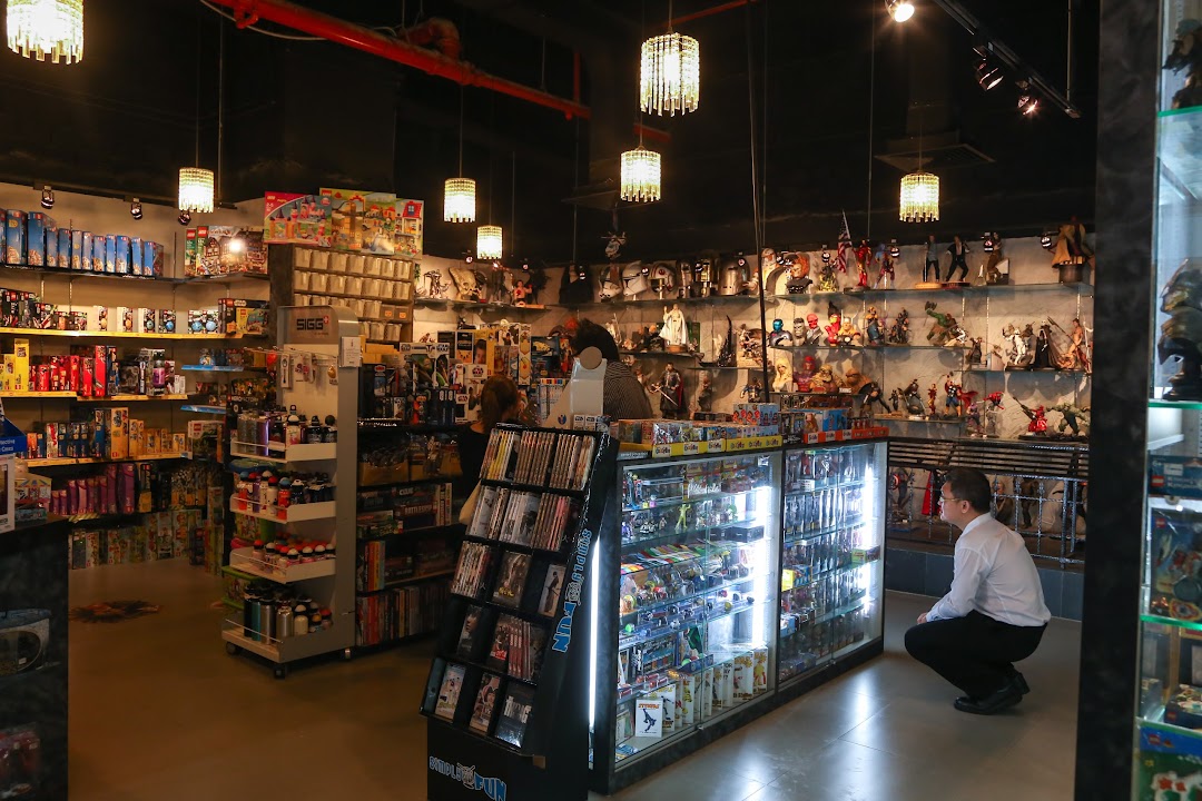 Interior view of Simply Toys, showcasing diverse collectibles, action figures, and toys on display.