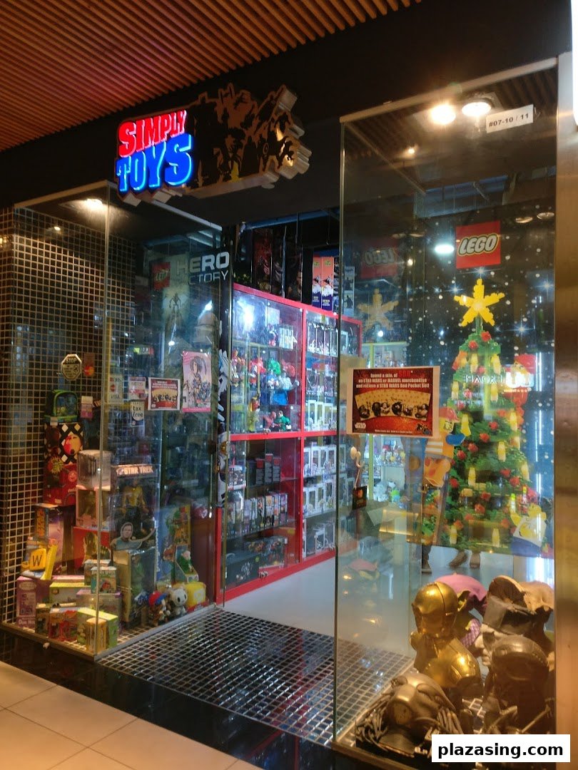 Brightly lit shop front of 'Simply Toys' showcasing a wide array of toys and pop culture collectibles.