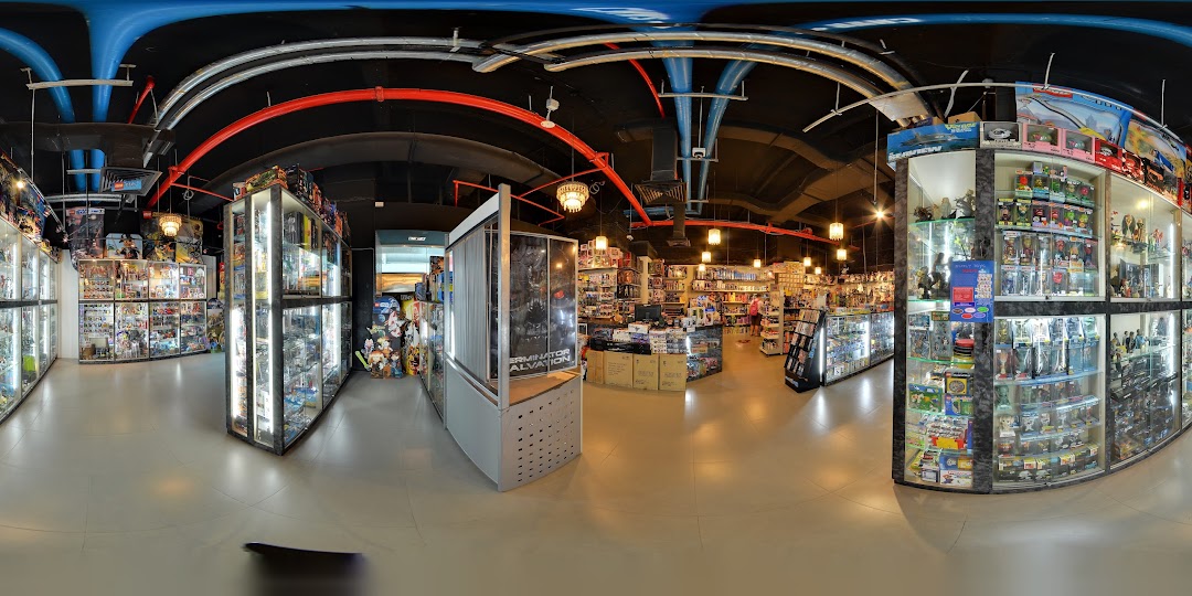 Interior view of Simply Toys, showcasing numerous display cases filled with collectibles, action figures, and toys.