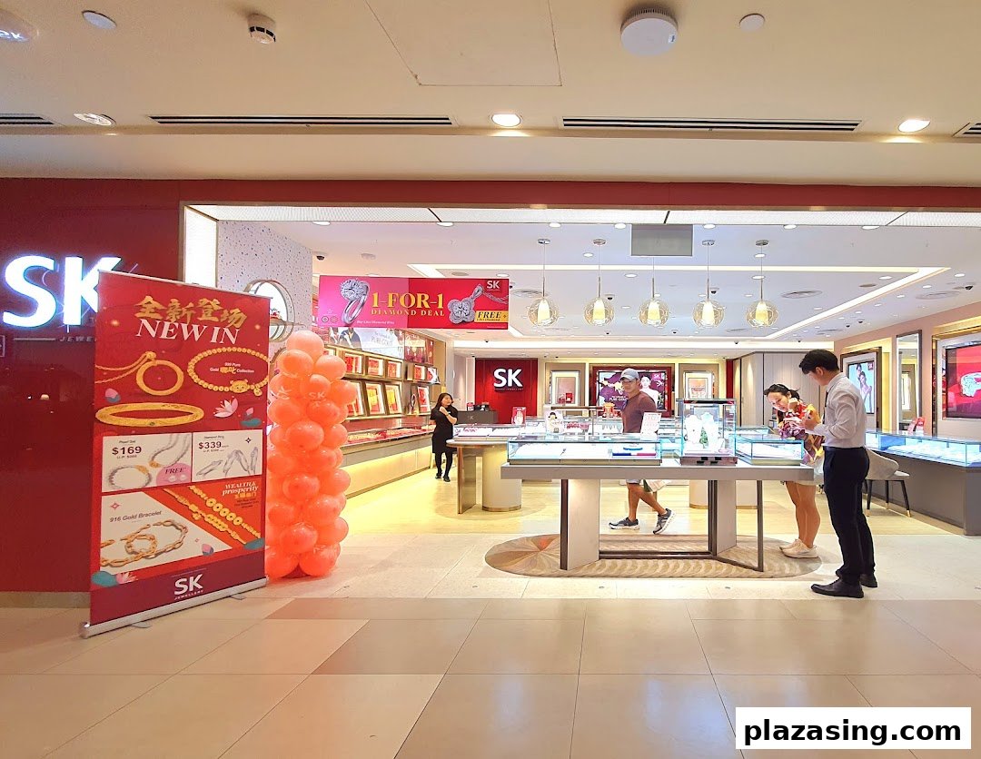 The inviting entrance of SK Jewellery, showcasing its bright interior, display cases, and promotional banners.