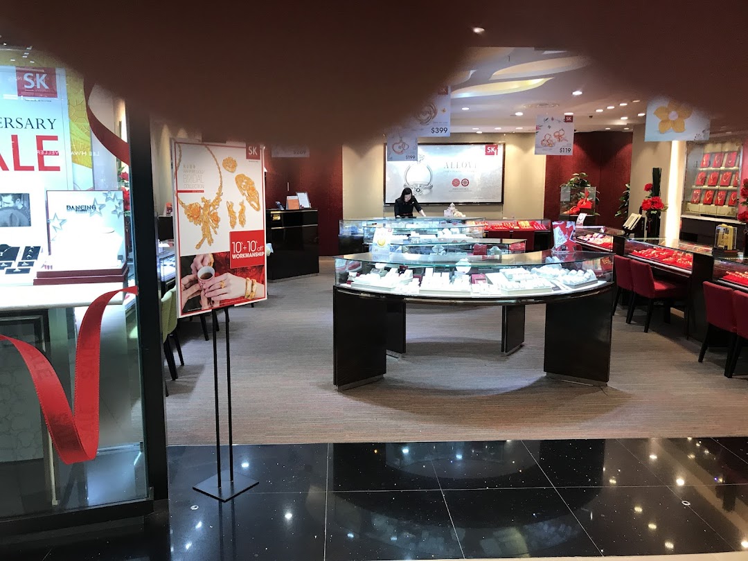 Interior view of SK Jewellery, showcasing various display cases filled with exquisite gold and diamond pieces.