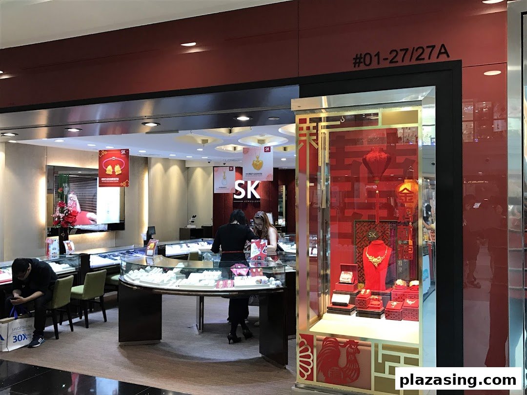 The image captures the inviting entrance of SK Jewellery, showcasing elegant displays and customers browsing exquisite pieces.