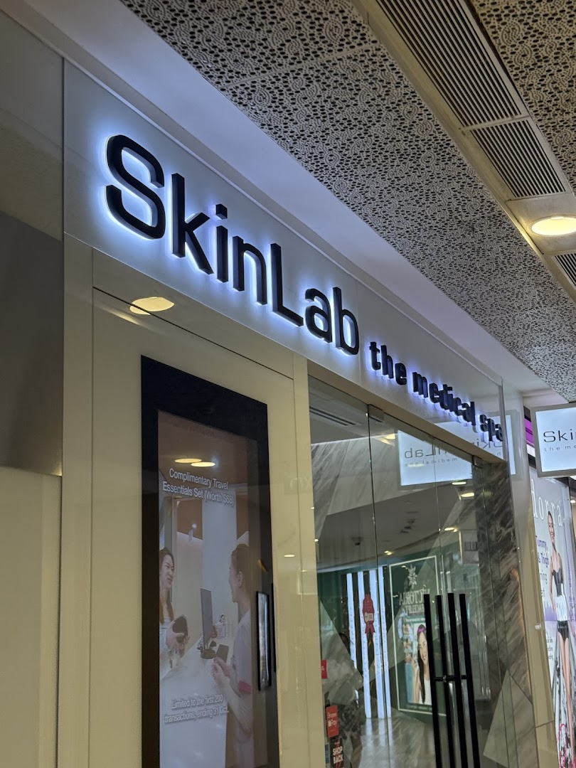 The illuminated storefront of SkinLab The Medical Spa, featuring its prominent signage and entrance.