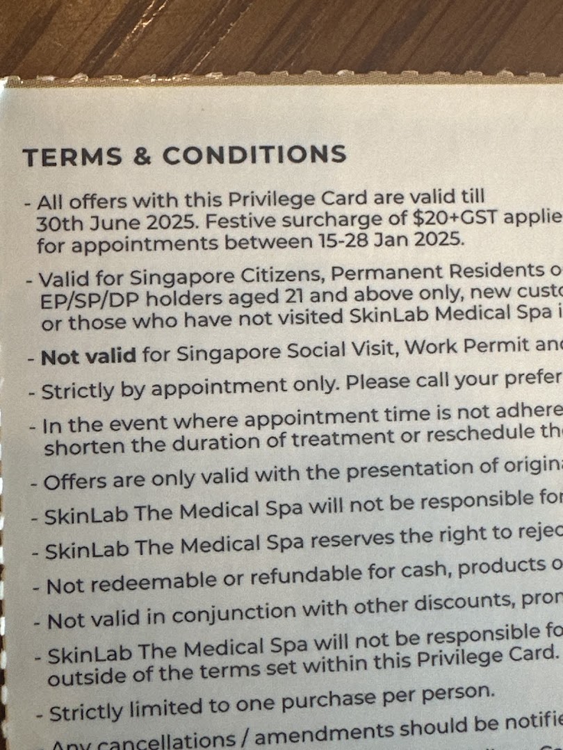 Close-up of SkinLab The Medical Spa's privilege card terms and conditions.