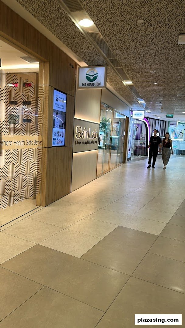 Exterior view of SkinLab The Medical Spa and Ma Kuang TCM in a shopping mall corridor.