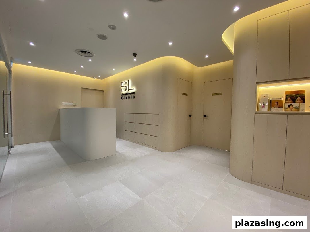 The modern and inviting reception area of SL Aesthetic Clinic with a sleek desk and warm lighting.