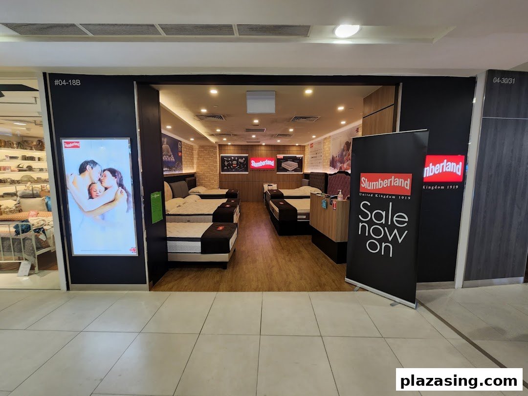 The inviting entrance of a Slumberland bedding store, showcasing various mattresses and a 'Sale now on' banner.