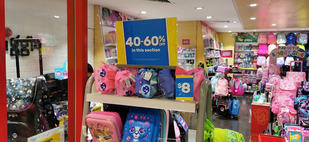Vibrant Smiggle store interior showcasing colorful bags, stationery, and accessories, with a 40-60% off sale sign.